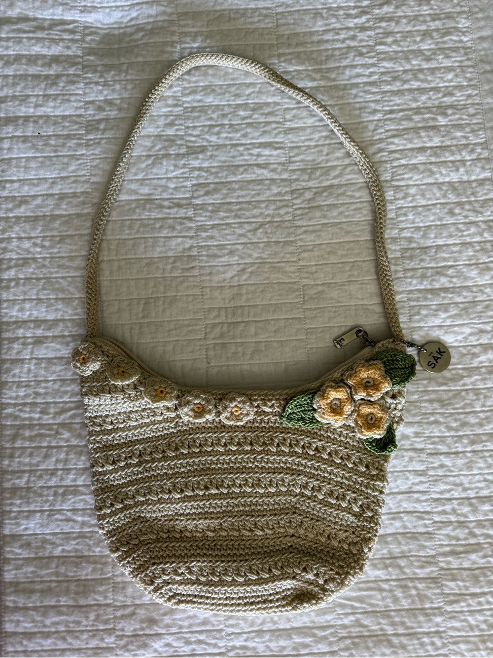 The Sak Cream Crochet Shoulder Bag with Yellow Floral Appliqué